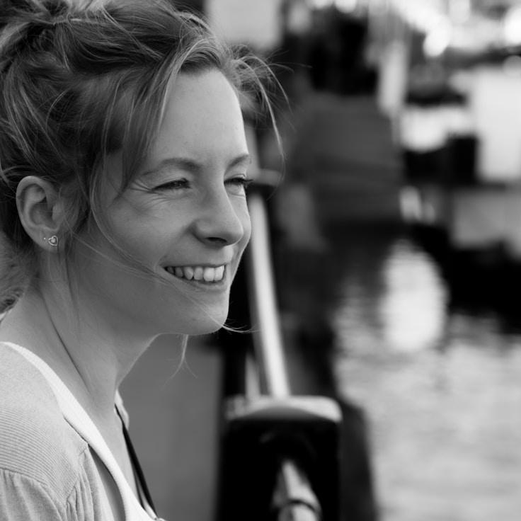 Alex Reed, Lead Design Curator at Atlas Quartz Parcel, reviewing corporate floral arrangements